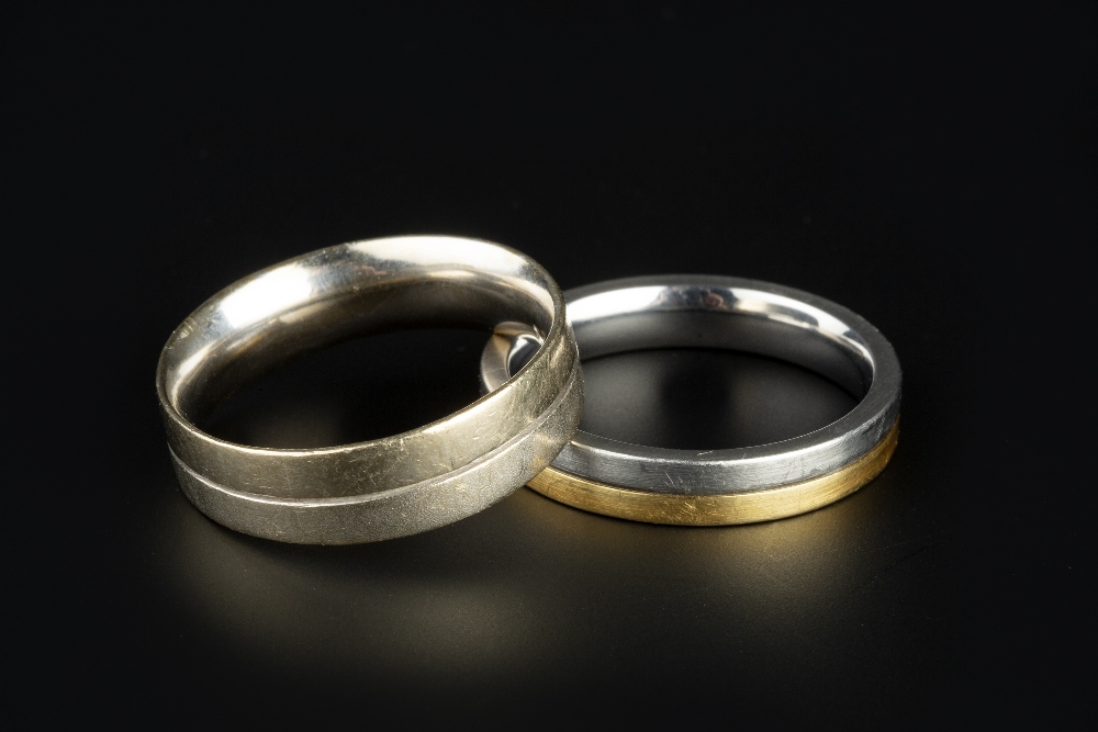 TWO WEDDING BANDS, the first a flat court section band with part-frosted decoration, stamped '