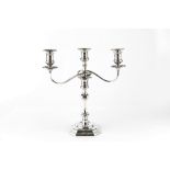 AN EDWARDIAN SILVER THREE LIGHT CANDELABRUM, with knopped and faceted column, chamfered square