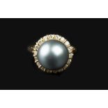 A TAHITIAN CULTURED PEARL AND DIAMOND CLUSTER RING, the Tahitian cultured pearl measuring