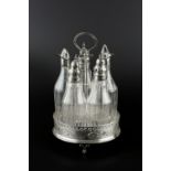 A GEORGE III SILVER CRUET STAND, with pierced and engraved decoration and central loop handle,