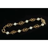 A CULTURED PEARL FANCY-LINK BRACELET, comprising a line of hoop-shaped wirework panels spaced by