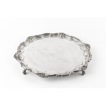 A SILVER SALVER, with scroll and scallop cast border, on scroll feet, by Brook & Son, Sheffield