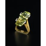 A GREEN BERYL AND DIAMOND DRESS RING BY ANDREW GRIMA, the fancy-cut green beryl set between four