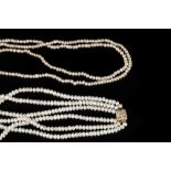 A FRESHWATER PEARL NECKLACE WITH DIAMOND SET CLASP, the triple strand necklace with a square panel