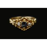A MID-19TH CENTURY SAPPHIRE AND DIAMOND THREE STONE RING, centred with a cushion-shaped sapphire and