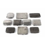 A COLLECTION OF TEN SILVER CIGARETTE CASES, including one of lobed outline, another with engine