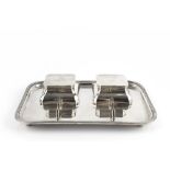 A SILVER INKSTAND, of rounded rectangular form, with reeded border, two lidded inkwells (lacking