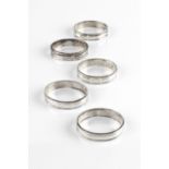 A SET OF FIVE SILVER HEAVY GAUGE NAPKIN RINGS, by Payne & Son, London 1970, five further silver
