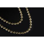 AN 18CT TWO COLOUR GOLD NECKLACE AND BRACELET SUITE, of fancy-link design, maker's mark FA, necklace