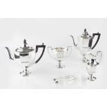 A LATE VICTORIAN SILVER FOUR PIECE TEA AND COFFEE SERVICE, of octagonal pedestal design, the