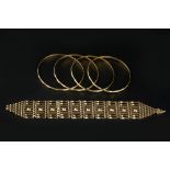 A 9CT GOLD GATE-LINK BRACELET, with bead accents, and four yellow precious metal bangles, with