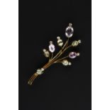A VARI GEM-SET SPRAY BROOCH, of wirework design, issuing a spray of oval mixed-cut pink topaz and