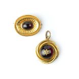 A VICTORIAN GARNET AND DIAMOND SET PENDANT, the cabochon garnet centred with an old-cut diamond in