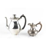 A SILVER COFFEE POT, of oval baluster form, with ebonised handle and knop, by Horace Woodward & Co