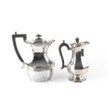 AN EDWARDIAN SILVER HOT WATER POT, with reeded shaped baluster body, and ebonised handle and knop,