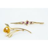 TWO GEM SET BROOCHES, comprising a ruby three stone bar brooch, the oval mixed-cut rubies in