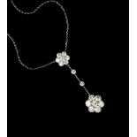 A DIAMOND CLUSTER PENDANT NECKLACE, the flowerhead cluster drop of round brilliant-cut diamonds in
