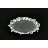 A WILLIAM IV SILVER SALVER, with foliate and scroll cast border, engraved foliate decoration and