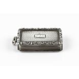 A MID VICTORIAN SILVER VINAIGRETTE, of rectangular form, with scroll cast border, by Nathaniel