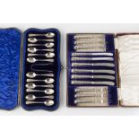 A SET OF TWELVE EDWARDIAN SILVER TEASPOONS, with foliate engraved decoration, and matching sugar