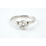 A DIAMOND SINGLE STONE RING, the round brilliant-cut diamond in eight claw setting, white precious
