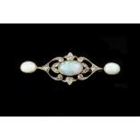 AN OPAL AND DIAMOND PANEL BROOCH, centred with a trio of oval cabochon opals in millegrain collet