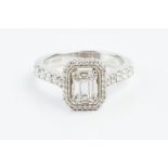 A DIAMOND CLUSTER RING, centred with a pierced rectangular cluster of baguette and round brilliant-