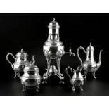 A FRENCH SILVER FIVE PIECE TEA AND COFFEE SERVICE with foliate decorated handles and scroll feet,