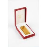 LE MUST DE CARTIER: a gold plated lighter, with ridged decoration, no. 381031, boxed, 7cm;