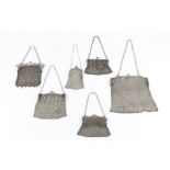 A COLLECTION OF SIX VARIOUS SMALL SILVER MESH EVENING PURSES, all with chain link handles, largest