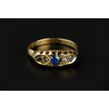 A SAPPHIRE AND DIAMOND HALF HOOP RING, alternately set with graduated circular-cut sapphires and