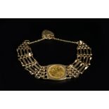 A HALF SOVEREIGN SET BRACELET, the Edward VII half sovereign dated 1910, loose mounted to a 9ct gold