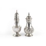 AN EDWARDIAN SILVER SUGAR CASTOR, of baluster form, repoussé decorated with spiral lobes and foliate