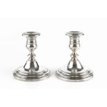 A PAIR OF AMERICAN DWARF CANDLESTICKS, with knopped stems and circular weighted bases, by Garham,