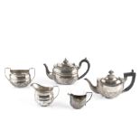 A SILVER THREE PIECE TEA SERVICE, the teapot with ebonised handle and knop, by Nathan & Hayes,