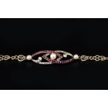 A RUBY, DIAMOND AND PEARL SET PANEL BRACELET, centred with two entwined openwork navette-shaped