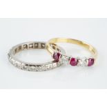 A RUBY AND DIAMOND FIVE STONE RING, alternately set with circular mixed-cut rubies and round