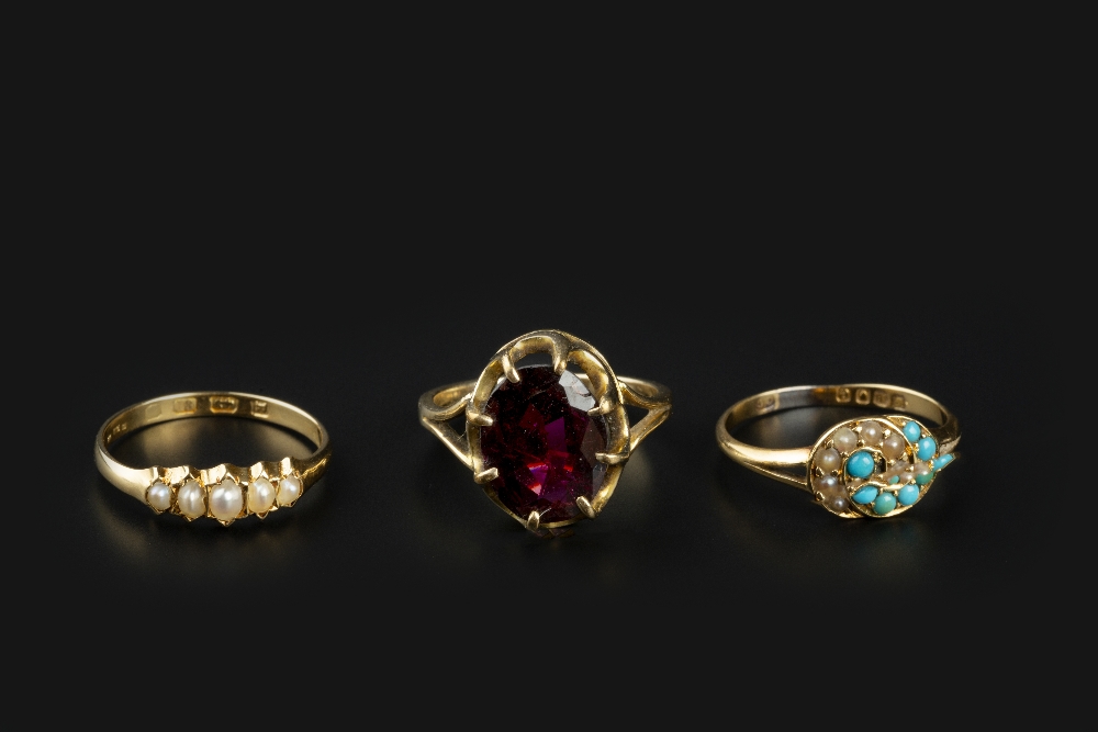 THREE GEM SET RINGS, comprising a late Victorian turquoise and half pearl panel ring, 18ct gold