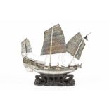 A LATE 19TH CENTURY CHINESE WHITE METAL MODEL of a War Junk, with three sails, and figures and