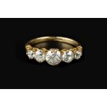 A DIAMOND FIVE STONE RING, the graduated old brilliant-cut diamonds in claw setting, above a