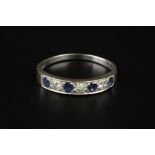 A SAPPHIRE AND DIAMOND HALF HOOP RING, alternately set with circular mixed-cut sapphires and round
