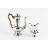 A GEORGE IV SILVER BALUSTER COFFEE POT, the spout modelled as a rustic branch, having flower