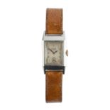 A GENTLEMAN'S STAINLESS STEEL WRISTWATCH BY ROLEX, circa 1930-35, the rectangular silvered dial with