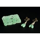 A JADEITE PANEL BROOCH AND A PAIR OF EAR PENDANTS, the rectangular panel brooch pierced and carved