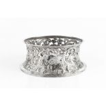 A LATE VICTORIAN SILVER DISH RING, the sides pierced and repoussé decorated with rustic figures,