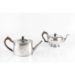 A GEORGE III SILVER TEAPOT, of oval section, with bright cut decoration, and fruitwood handle and