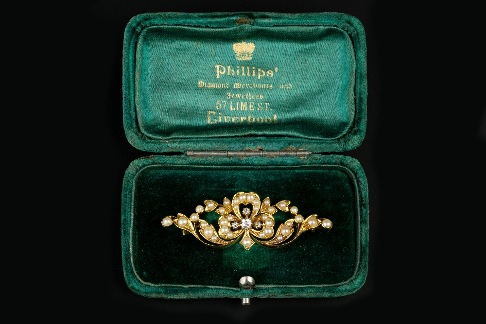 A LATE VICTORIAN/EDWARDIAN DIAMOND AND HALF PEARL PANEL BROOCH, centred with an old-cut diamond