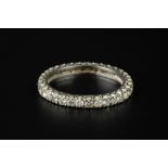 A DIAMOND FULL HOOP ETERNITY RING, set throughout with round brilliant-cut diamonds, white
