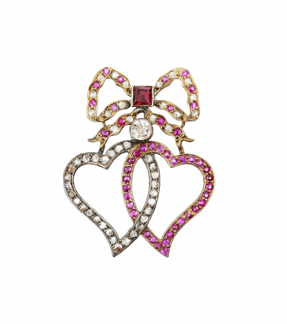 A 19TH CENTURY RUBY AND DIAMOND DOUBLE-HEART BROOCH/PENDANT, designed as two entwined openwork