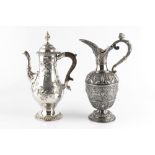 A VICTORIAN SILVER PLATED WINE EWER, relief decorated with masks, stags and stylised foliage, and